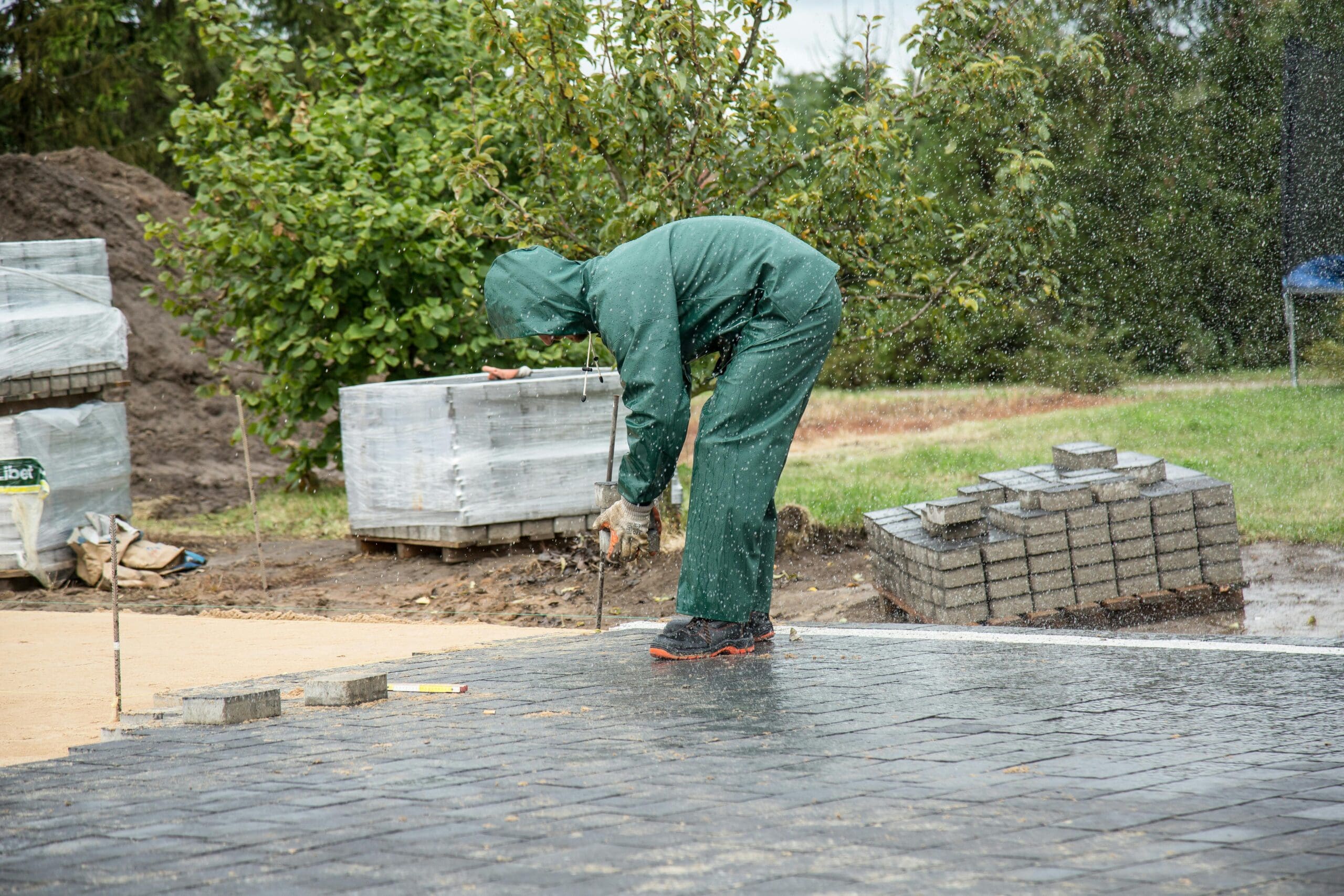Installing pavers in the yard.